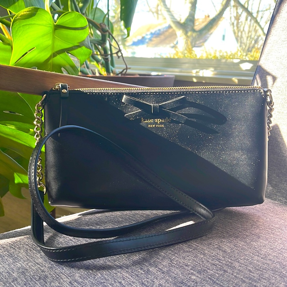 Like new Kate spade black leather cross body bag with gold accents